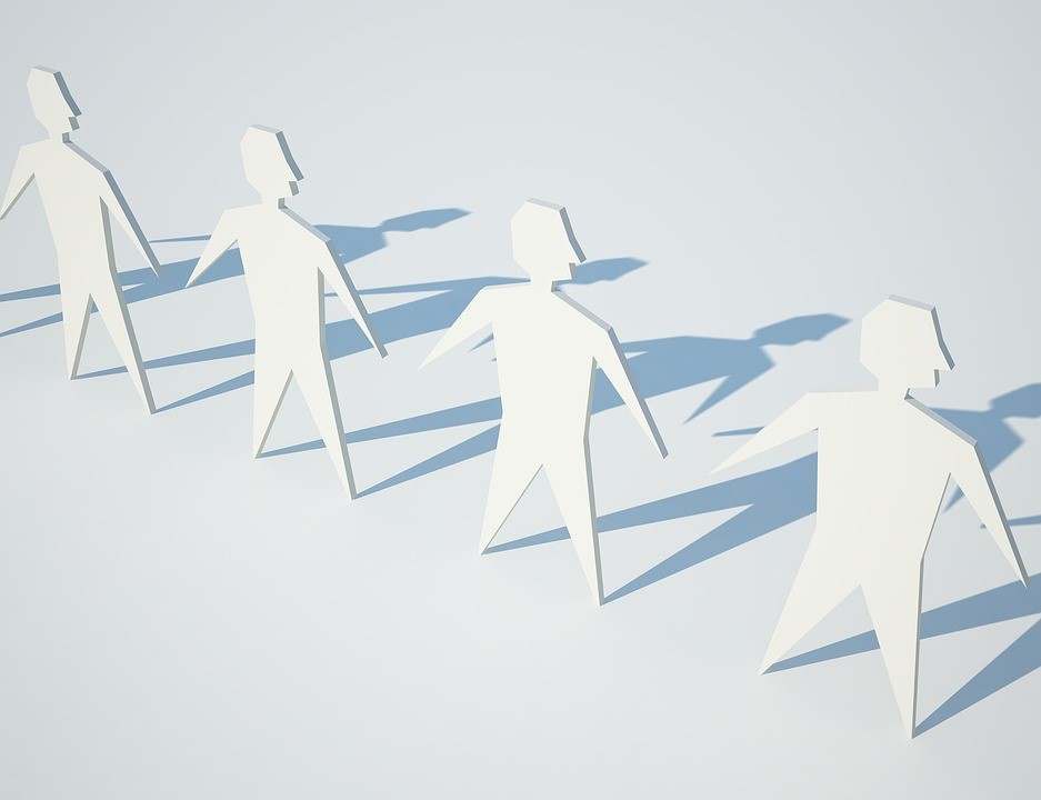 Image showing a chain of cut out people shapes